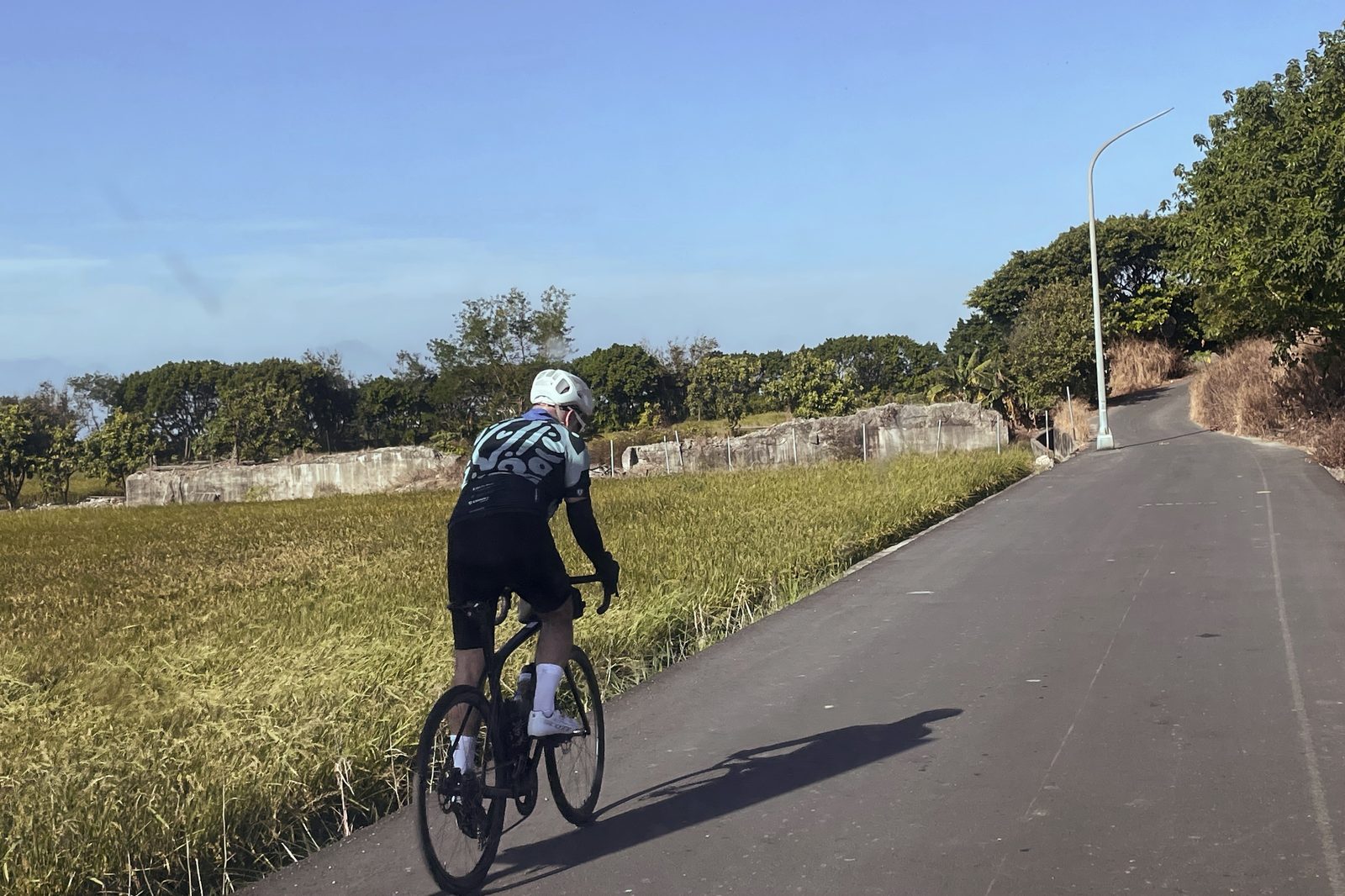 Riding past rice paddies and old bunkers