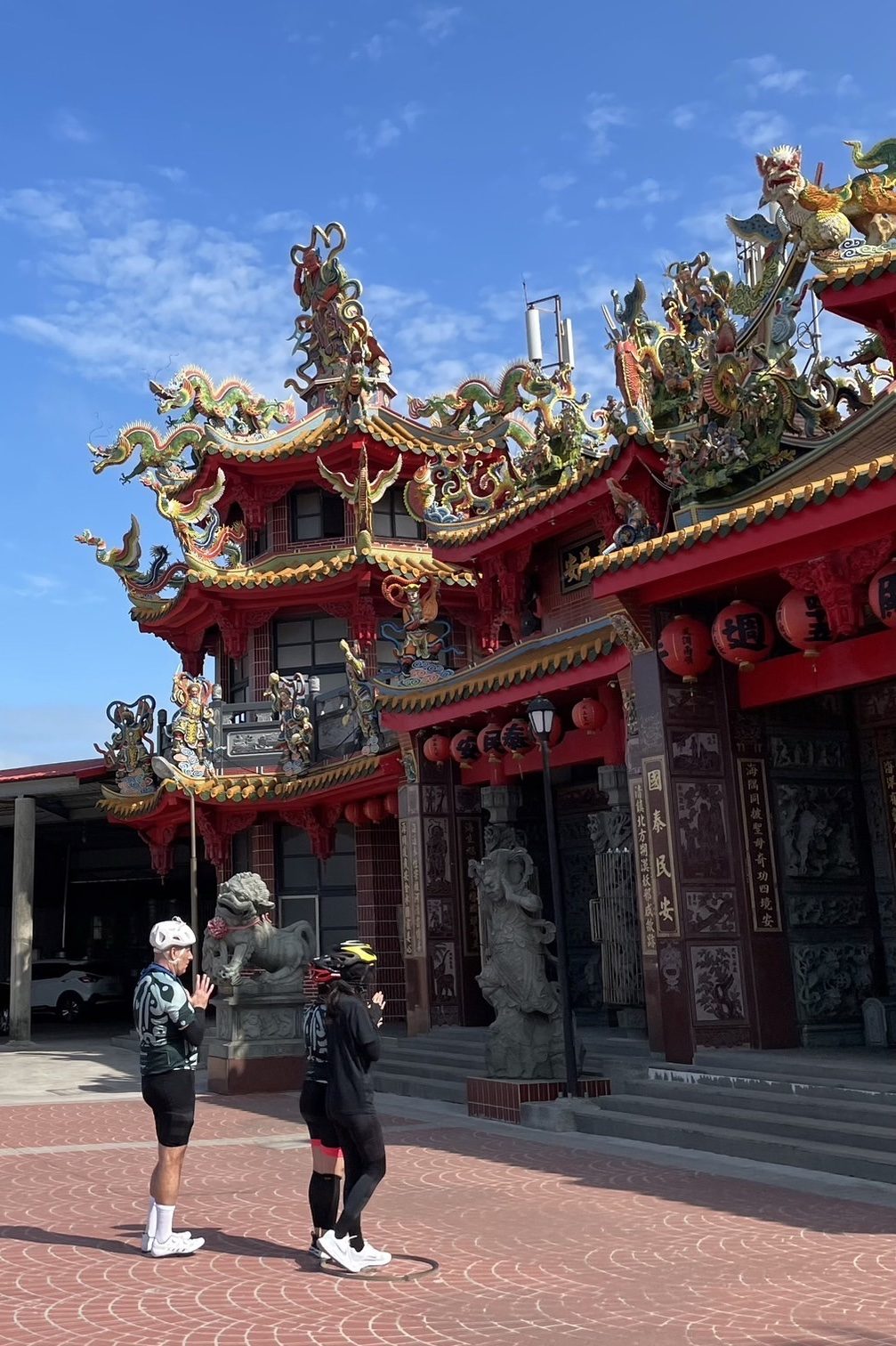 Pausing at a temple entrance with the group