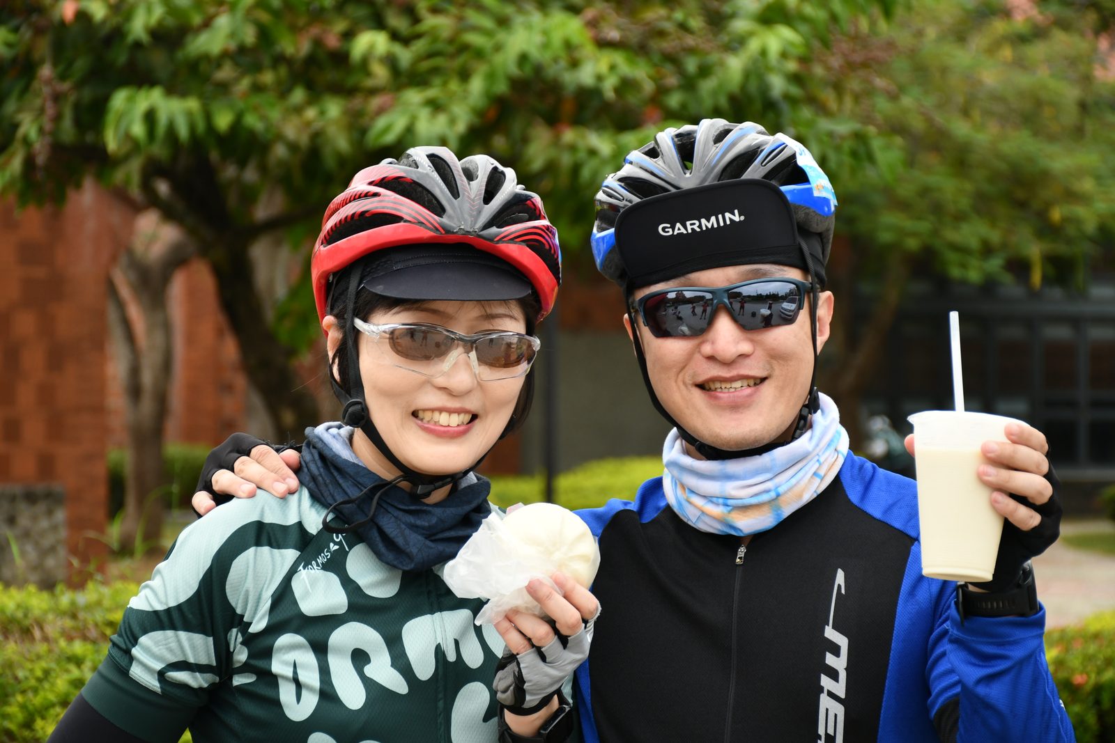 Two riders sharing snacks and drinks together