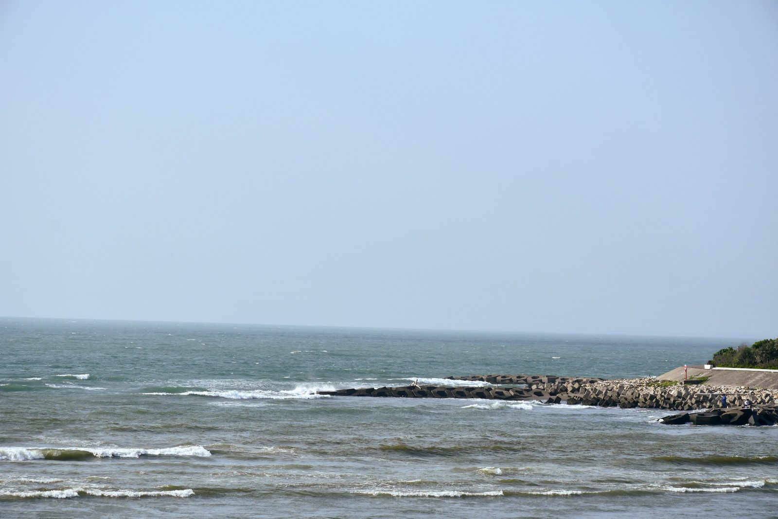 Waves breaking over a rocky breakwater