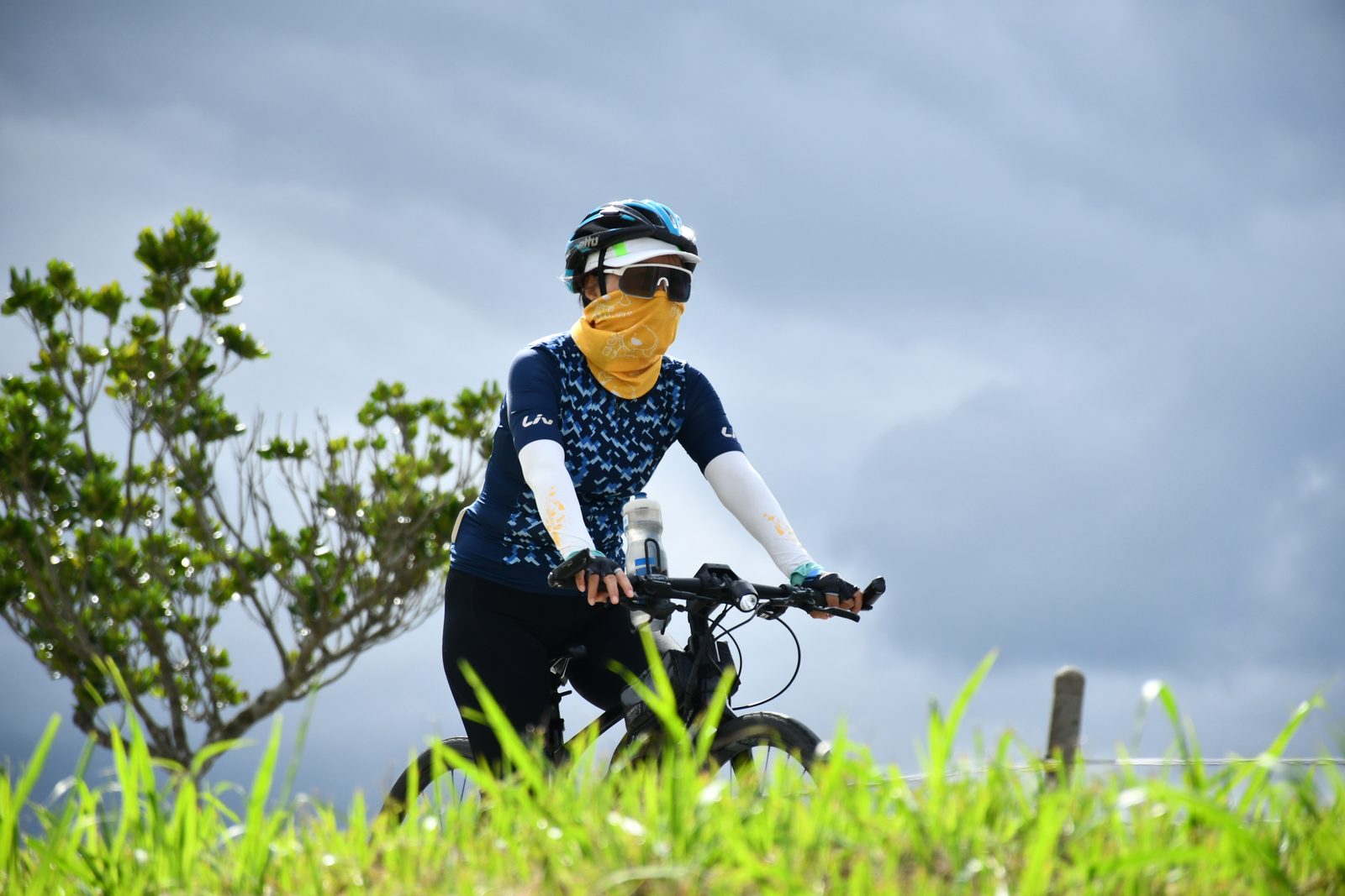 A masked rider pausing on the ridge