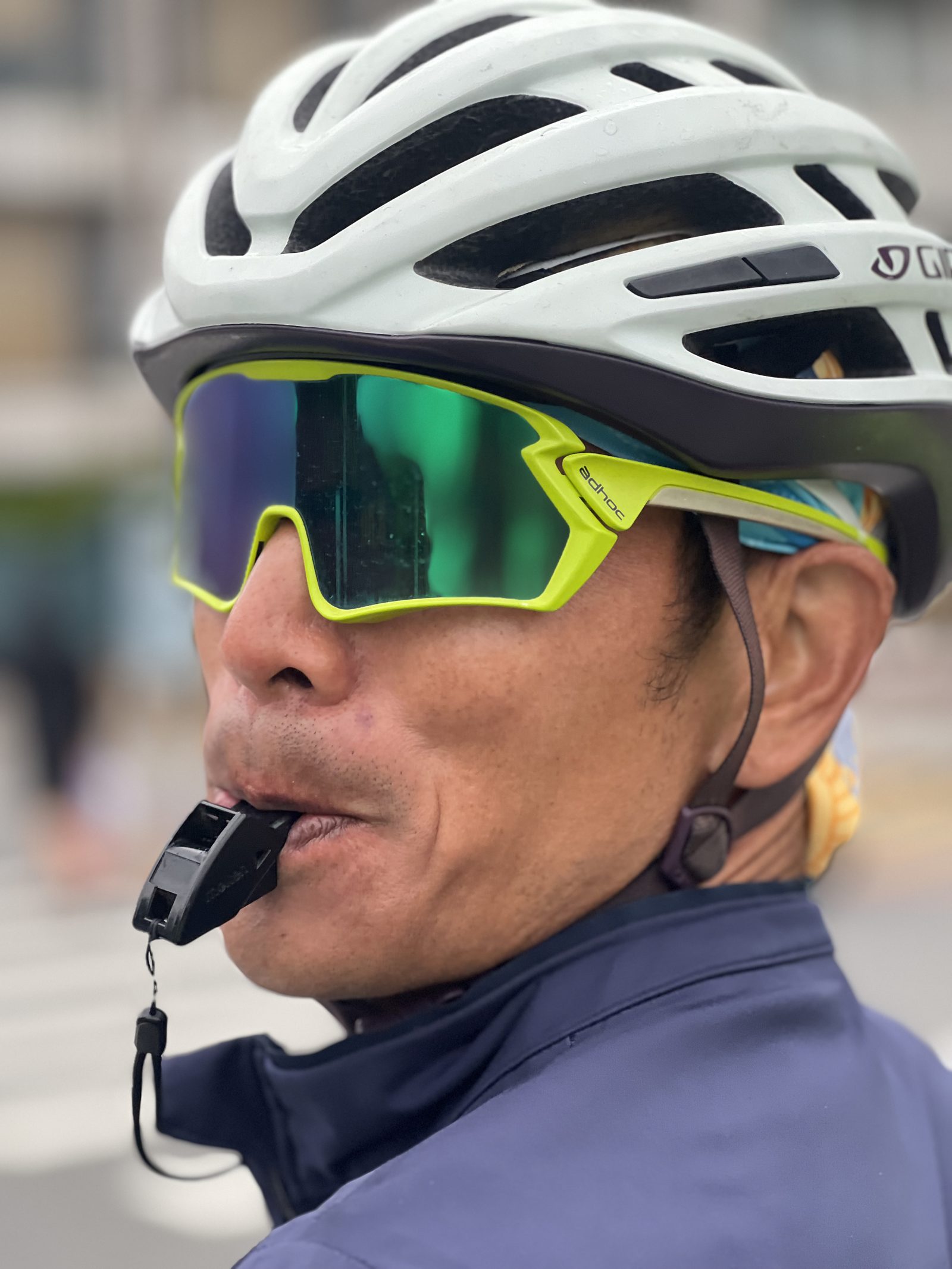 A portrait mid-whistle, keeping the group in line