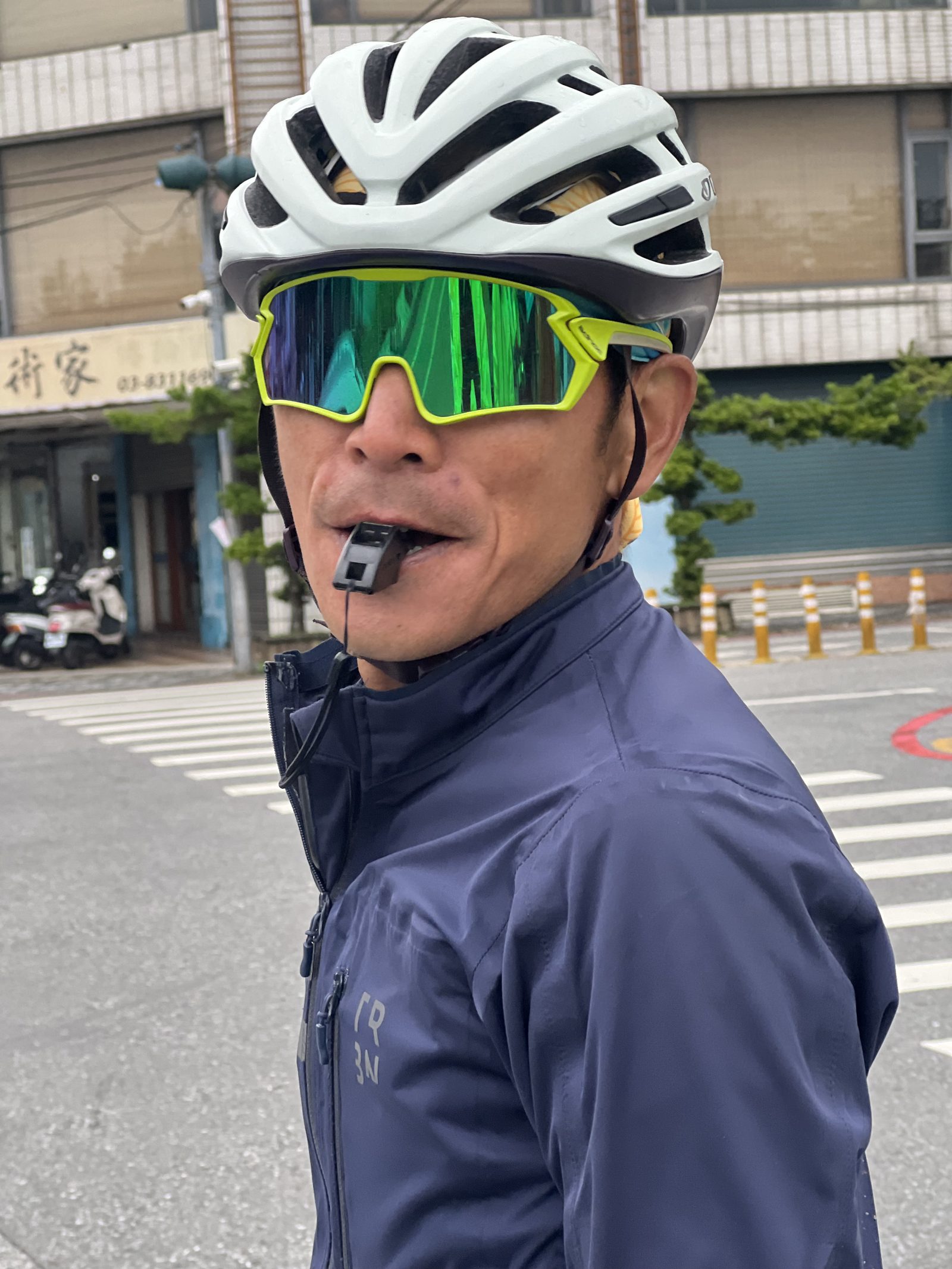 Another portrait mid-whistle on a quiet street