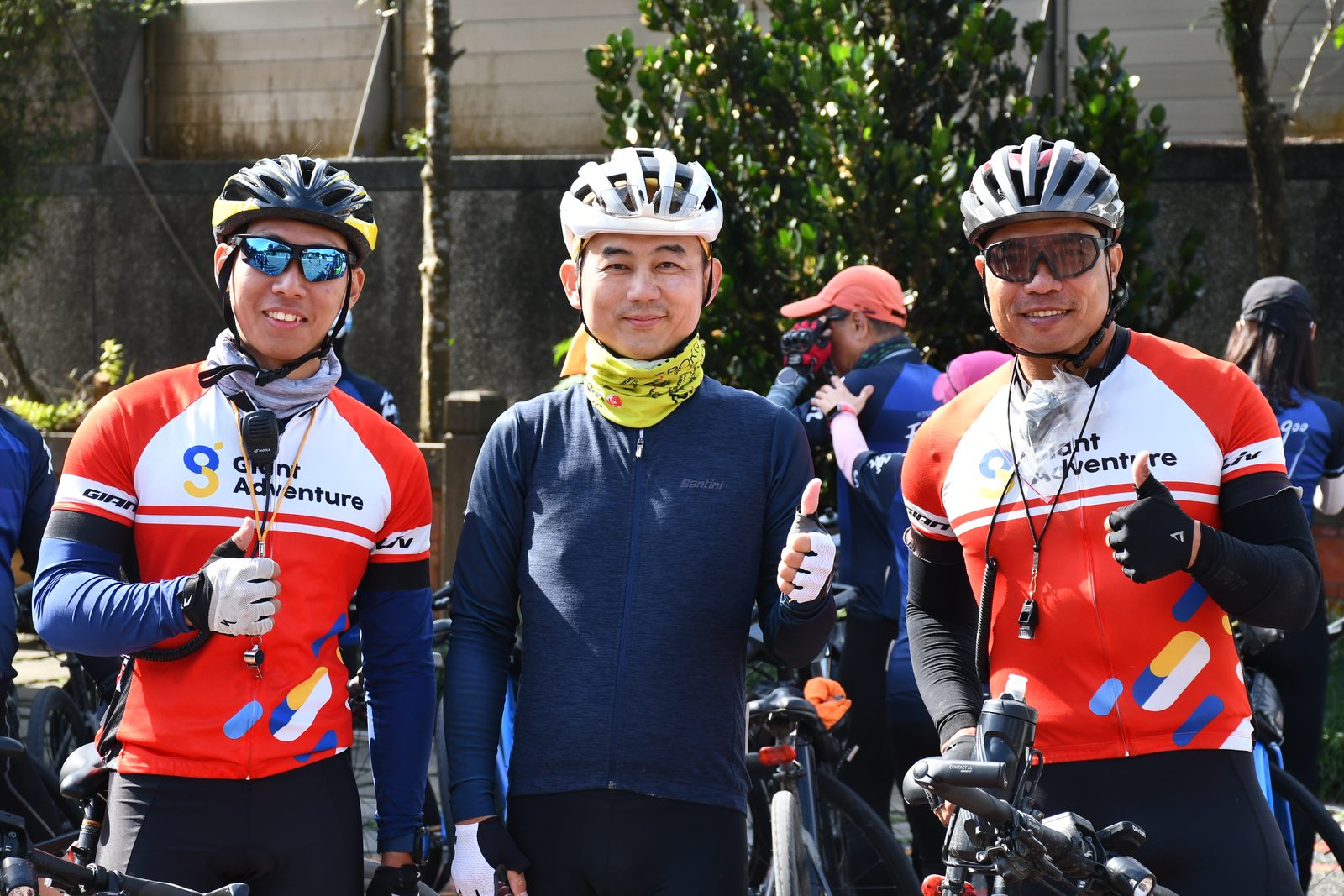 Three of the support crew posing together