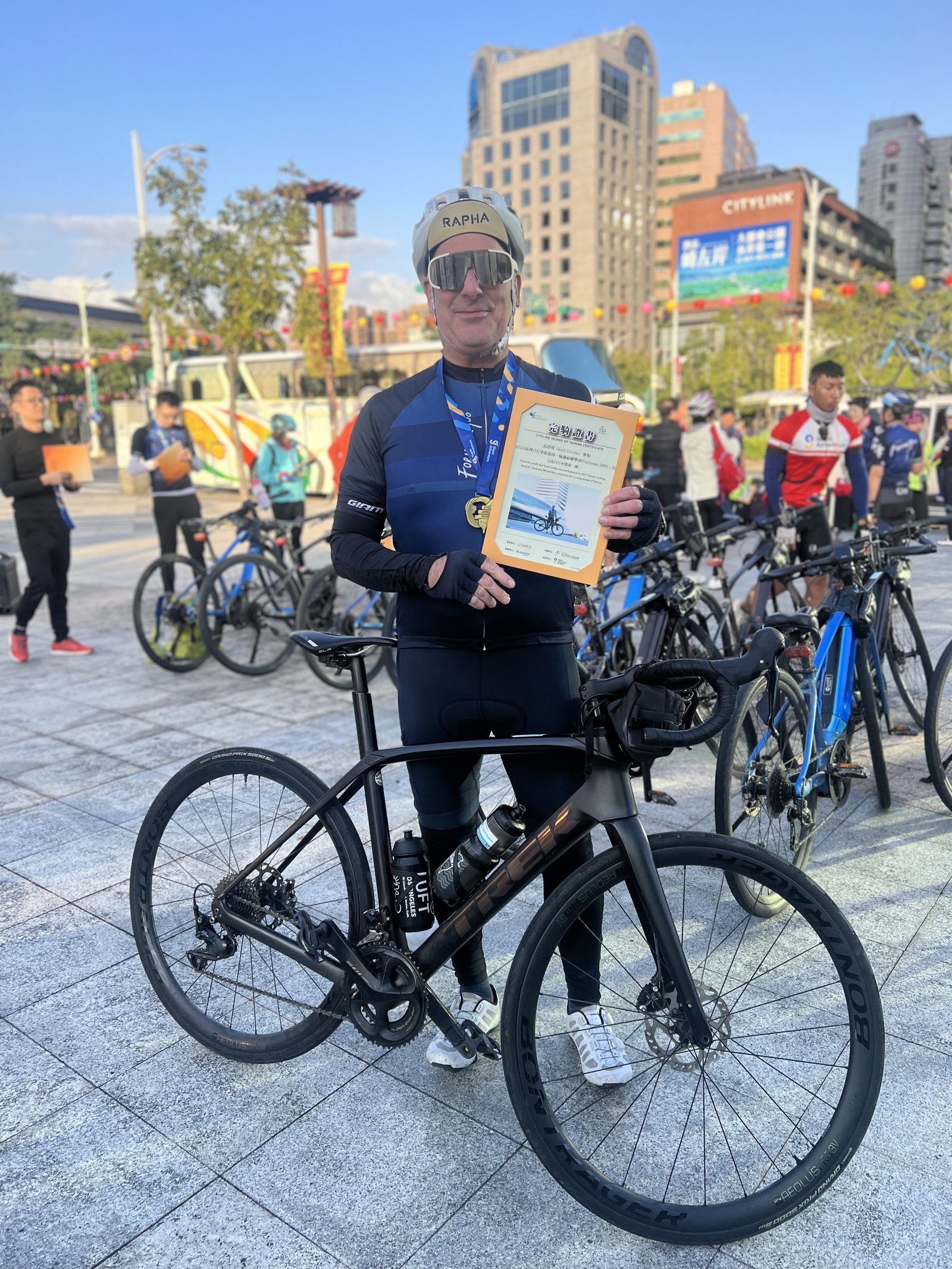 Holding the finisher certificate back at the start